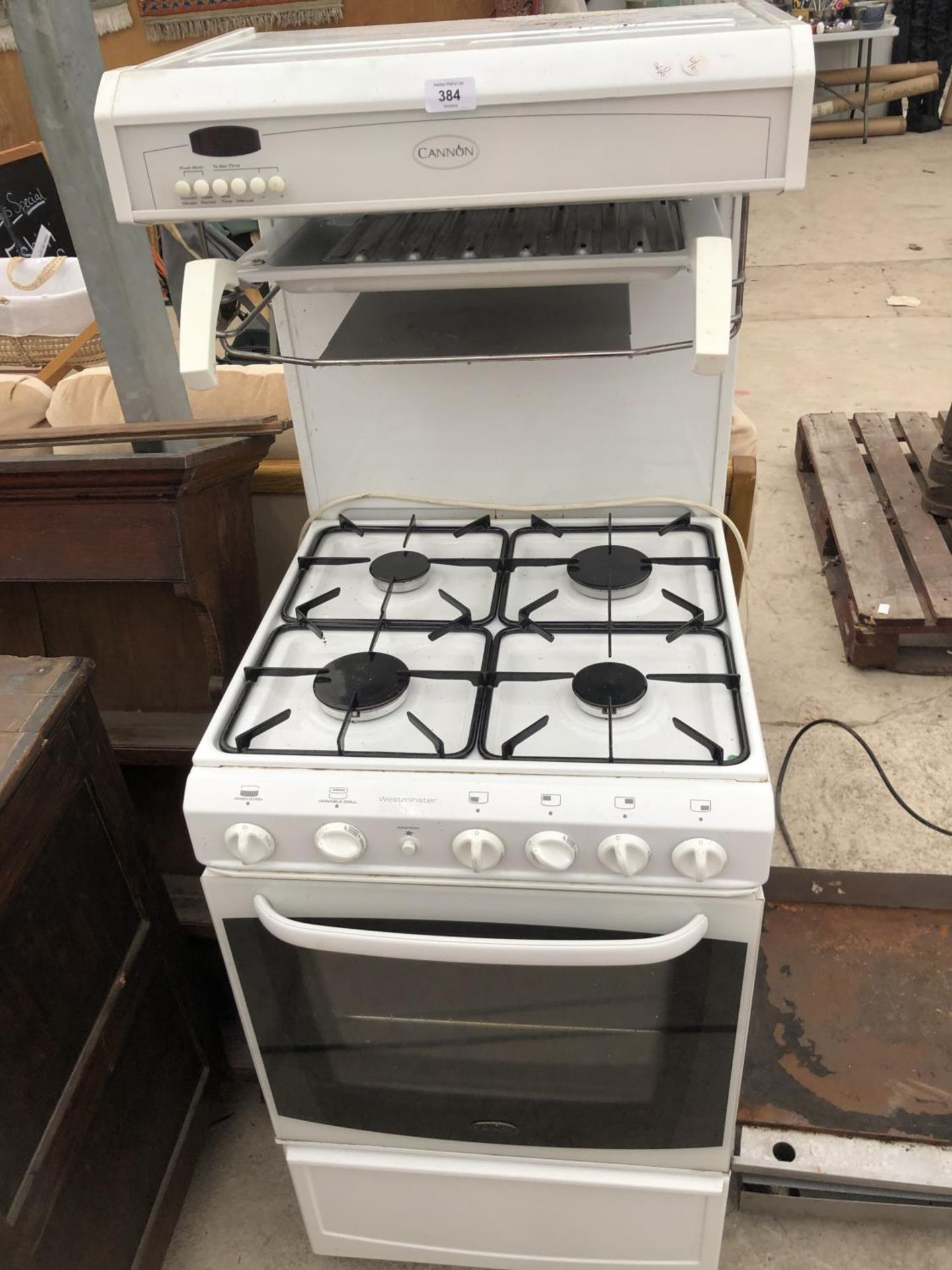 A FOUR RING GAS HOB WITH OVEN IN WORKING ORDER