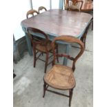 A TEAK TABLE AND SIX VICTORIAN MAHOGANY BALLOON BACK DINING CHAIRS WITH RATTAN SEATS