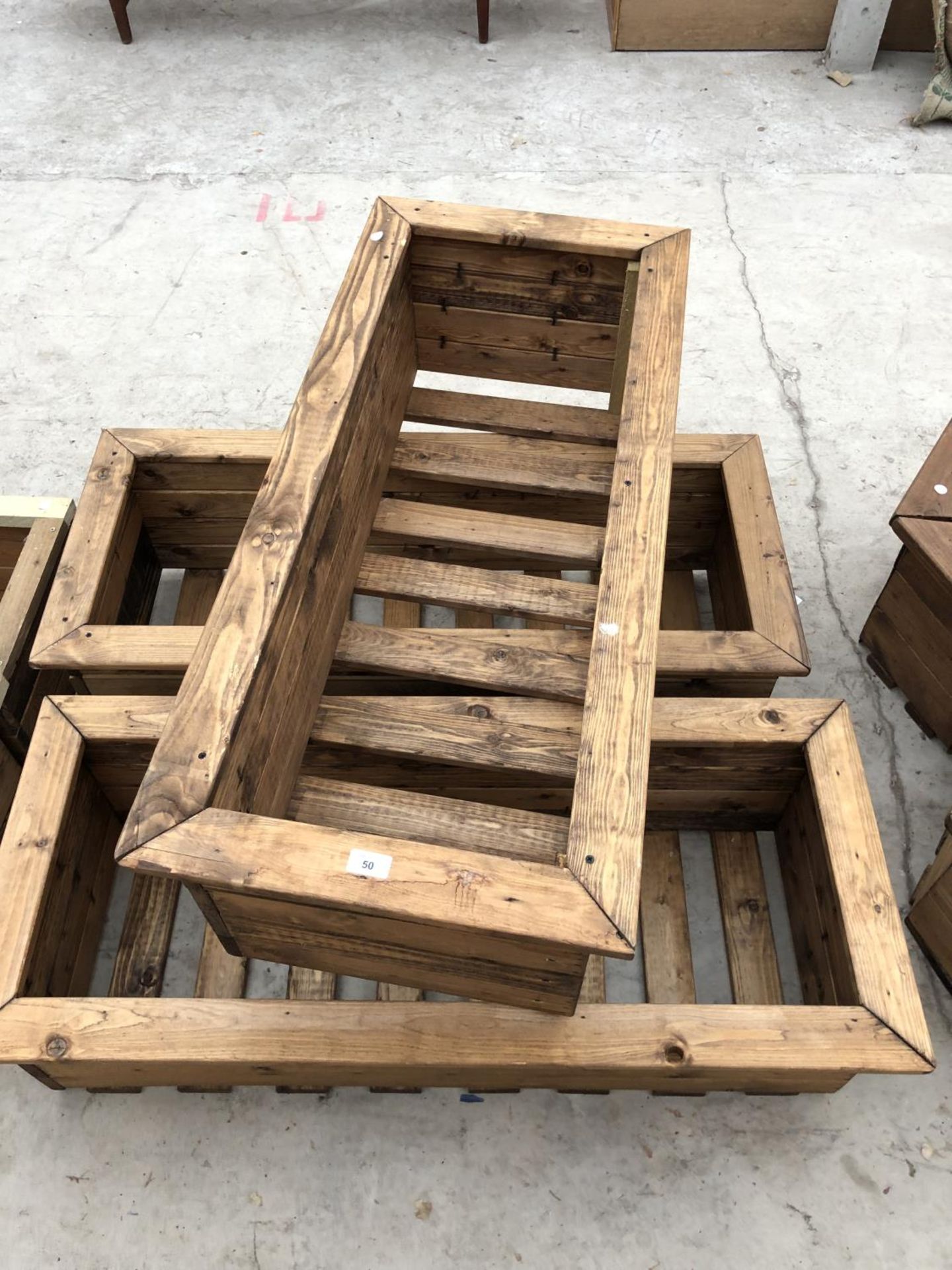 THREE WOODEN RECTANGULAR GARDEN PLANTERS