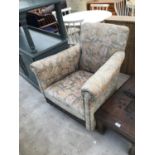 A VINTAGE FLORAL UPHOLSTERED PARLOUR CHAIR