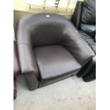 A BROWN LEATHER TUB CHAIR