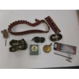 A CARTRIDGE BELT, THREE FURTHER BELTS, OIL CAN AND MINIATURE AXE ETC