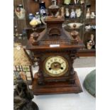 A CARVED OAK BAVARIAN STYLE MANTLE CLOCK