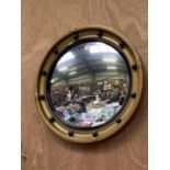 A VINTAGE PORT HOLE MIRROR