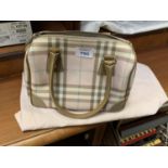 A BURBERRY HANDBAG AND STORAGE BAG