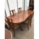 A YEW WOOD DINING TABLE WITH FOUR DINING CHAIRS AND TWO CARVERS