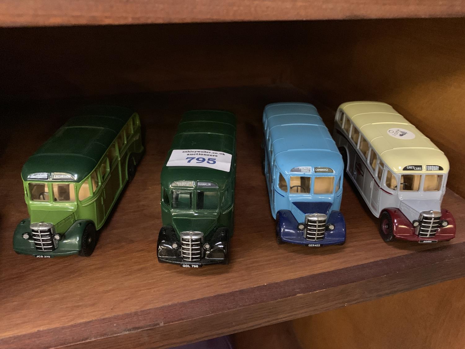 FOUR DIE CAST MODEL BUSES