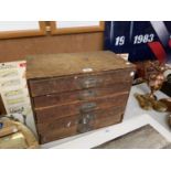 A VINTAGE FIVE DRAWER TABLE TOP TOOL CHEST AND CONTENTS