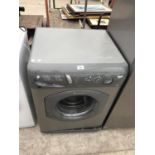 A HOTPOINT WASHING MACHINE IN WORKING ORDER