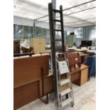 A LARGE VINTAGE WOODEN LADDER AND FURTHER METAL STEP LADDER