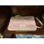 A PINK LADIES HANDBAG