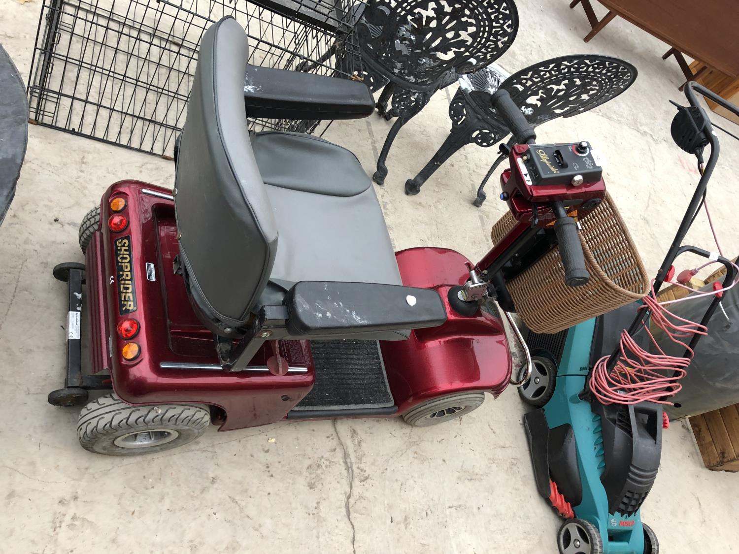 A SHOPRIDER MOBILITY SCOOTER WITH CHARGER AND KEY