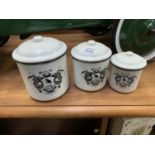 A GRADUATED SET OF THREE ENAMEL LIDDED POTS