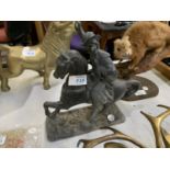 A VINTAGE METAL HORSE AND RIDER