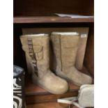 A PAIR OF UGG BOOTS IN A SIZE 5 TOGETHER WITH THE BOX