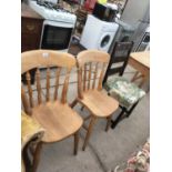 THREE CHAIRS TO INCLUDE TWO PINE FARMHOUSE STYLE AND A STAINED PINE UPHOLSTERED EXAMPLE
