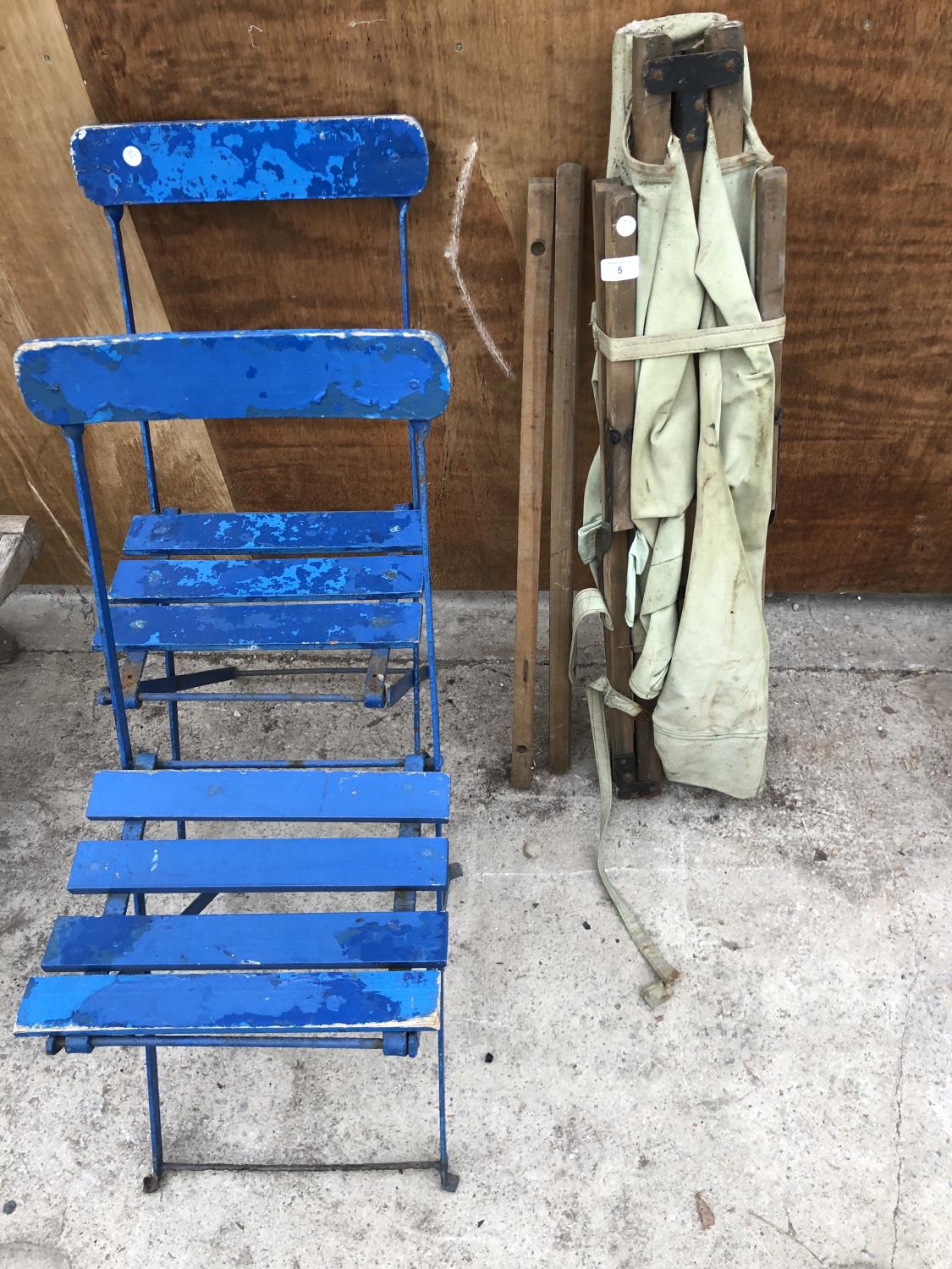 TWO BLUE FOLDING CHAIRS AND A STRETCHER (3)