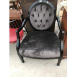 A BLACK FRAMED NURSING CHAIR WITH GREY UPHOLSTERED SEAT AND BUTTON BACK. THIS CHAIR COST £1300 AT