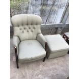 A PARKER KNOLL BUTTON BACK ARMCHAIR AND FOOTSTOOL