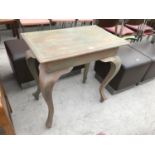 A WASHED PINE TABLE WITH BOW LEGS