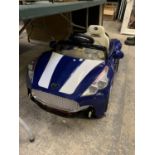 A CHILDREN'S BATTERY OPERATED CAR