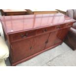 A YEW WOOD SIDEBOARD WITH FOUR DOORS AND THREE DRAWERS