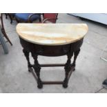 A CARVED MAHOGANY DEMI LUNE TABLE WITH MARBLE TOP AND SINGLE DRAWER