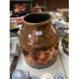 A LARGE VINTAGE COPPER AND BRASS MILK CHURN