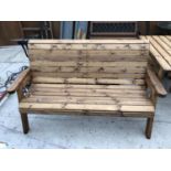 A TWO SEATER WOODEN GARDEN BENCH