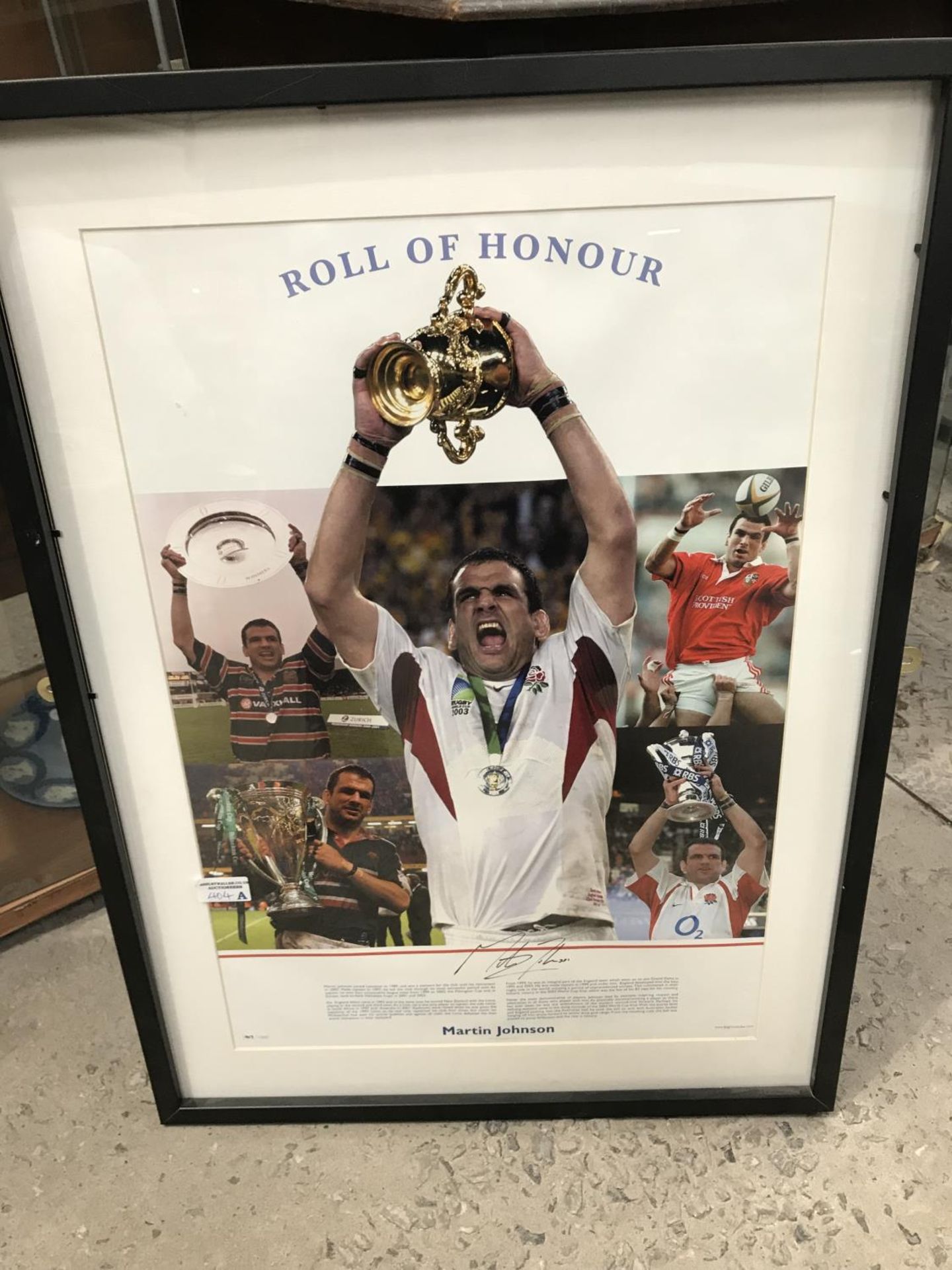 A FRAMED AND SIGNED MARTIN JOHNSON PHOTO