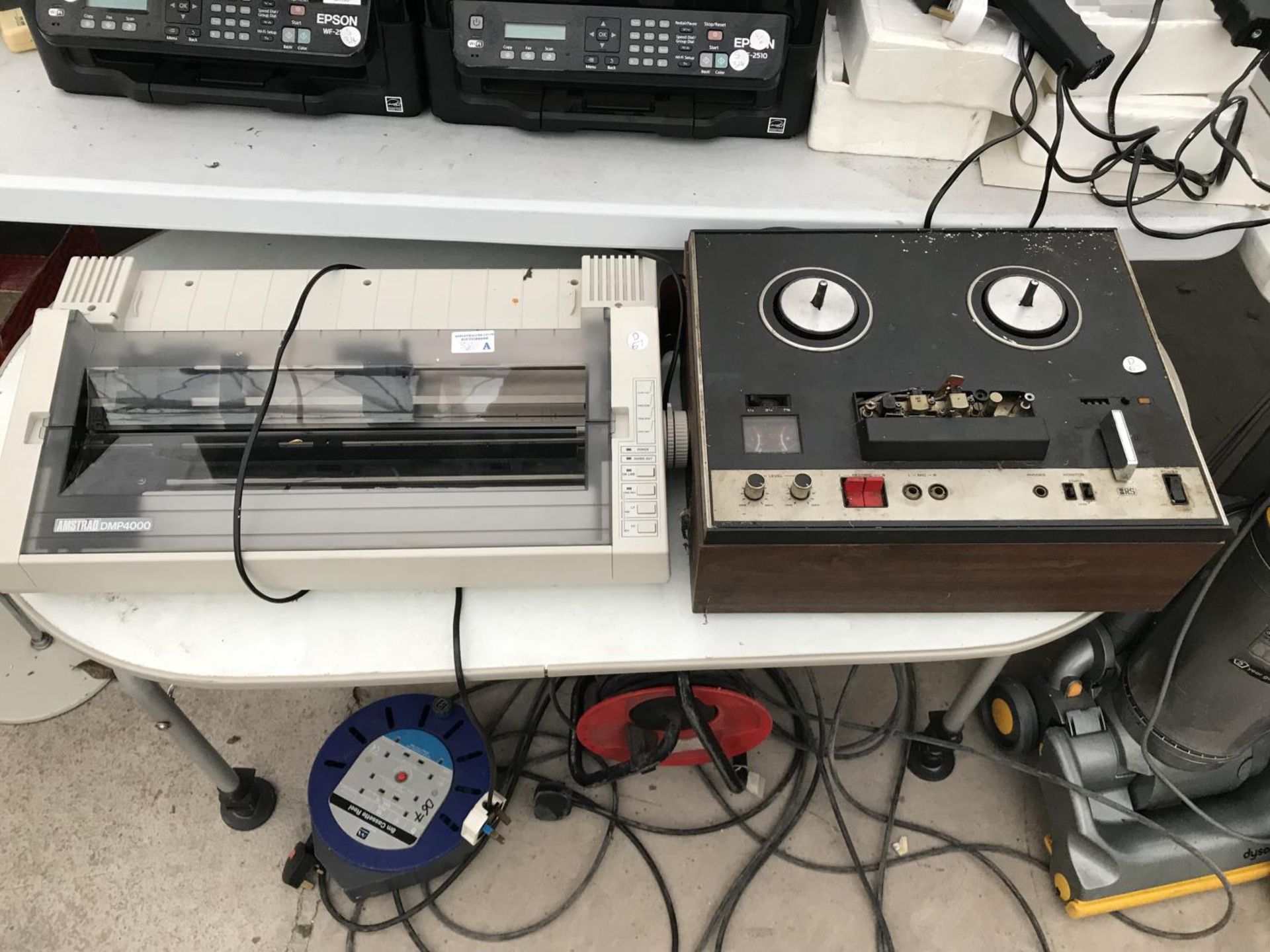 A VINTAGE REEL TO REEL RECORDING DECK AND AN AMSTRAD PRINTER