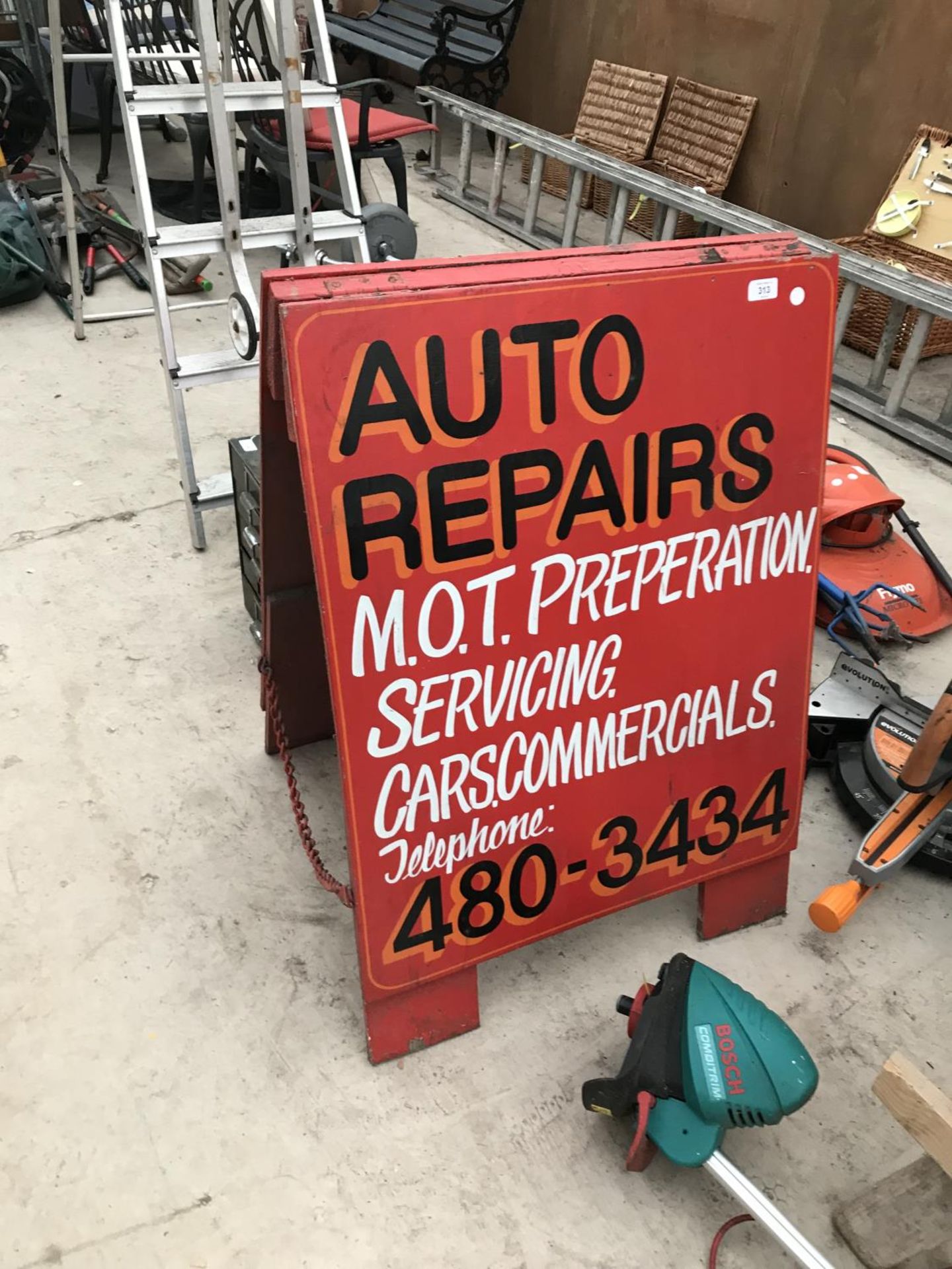 A WOODEN 'AUTO REPAIRS' A FRAME SIGN
