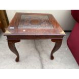 A MAHOGANY COFFEE TABLE WITH BRASS INLAY AND FITTINGS