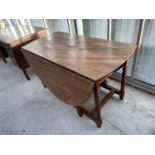 AN OAK DROP LEAF DINING TABLE