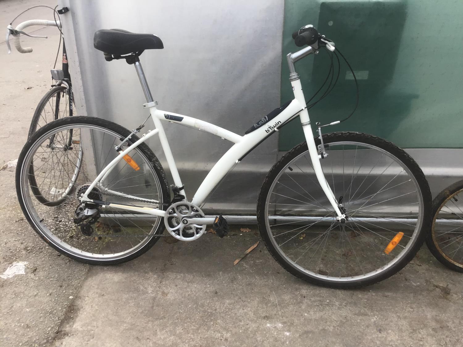 A B TWIN 3 MOUNTAIN BIKE WITH A TWENTY ONE SPEED SHIMANO GEAR SYSTEM