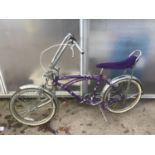 A BRATZ PURPLE CHOPPER STYLE BIKE