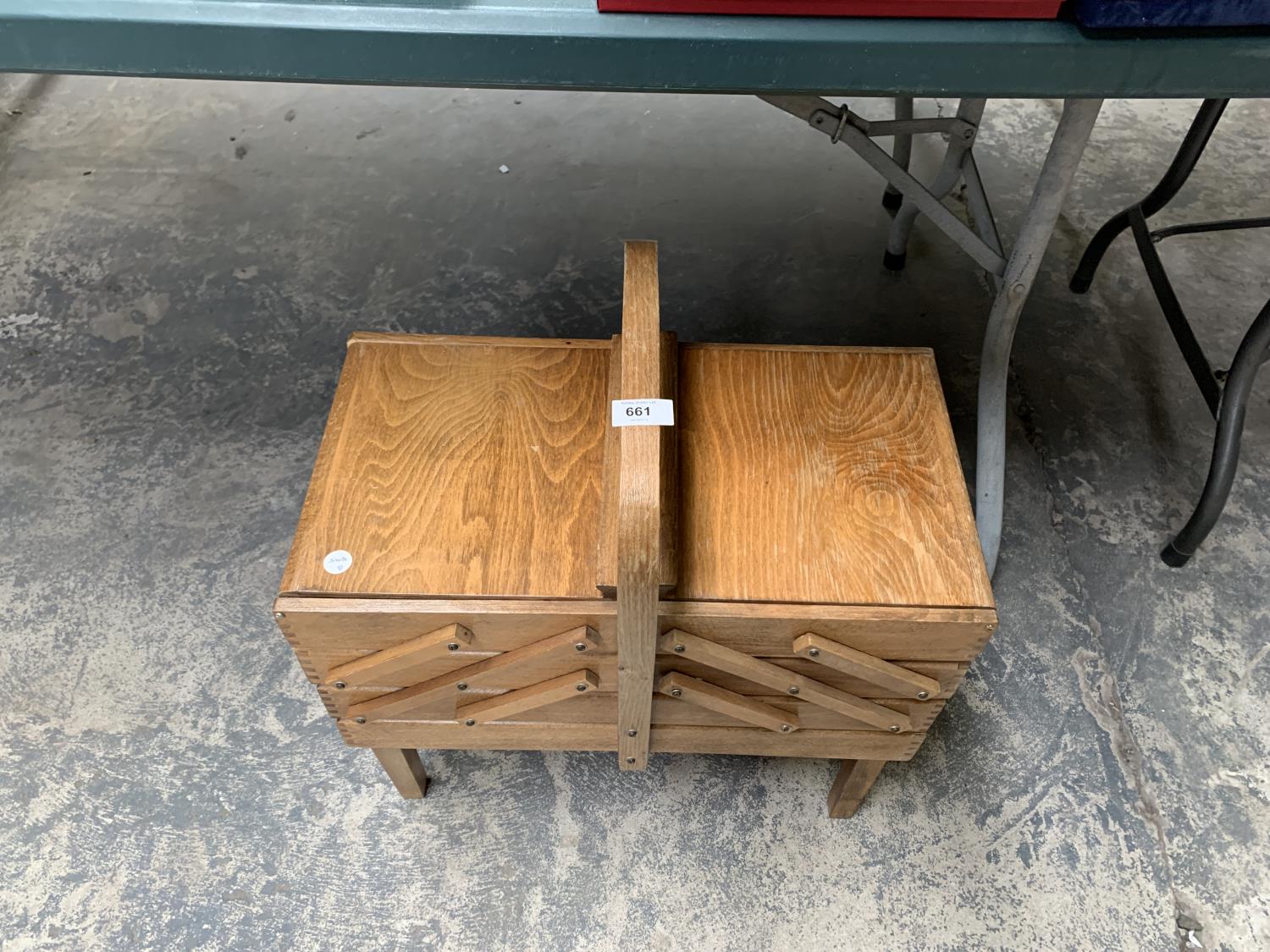 A WOODEN SEWING STORAGE BOX