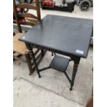 AN EBONISED SIDE TABLE