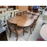 A MAHOGANY EXTENDING DINING TABLE WITH FOUR DINING CHAIRS AND TWO CARVERS