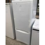 AN INDESIT FRIDGE FREEZER IN WORKING AND CLEAN CONDITION