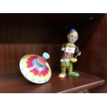 A TIN PLATE CLOWN AND SPINNING TOP (2)