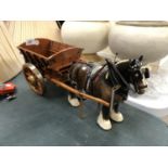 A CERAMIC BROWN GLOSS MODEL SHIRE HORSE AND WOODEN CART