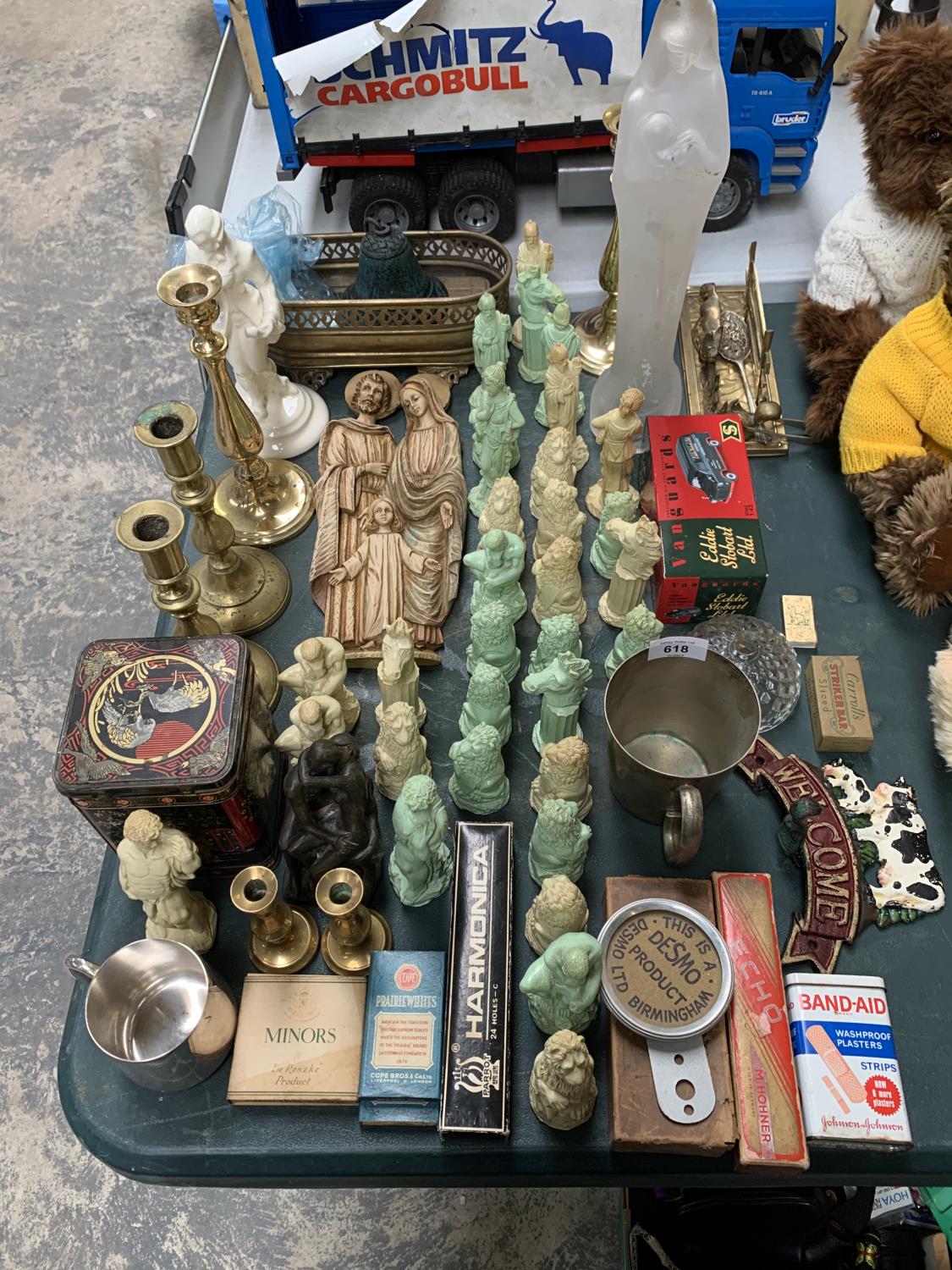 A COLLECTION OF CHESS PIECES, BRASS CANDLE STICKS, VINTAGE TINS ETC