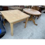 A BEECH DINING TABLE AND A PINE DINING TABLE