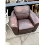 A BROWN LEATHER ARMCHAIR