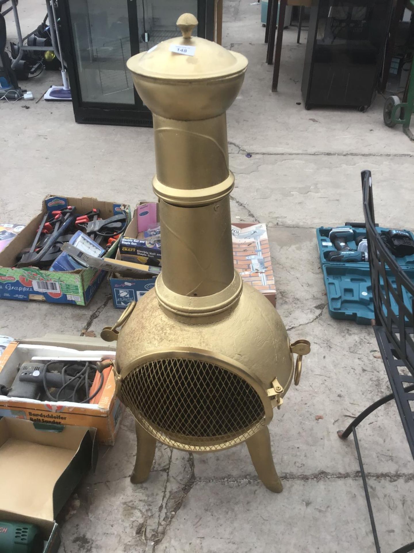 A GOLD PAINTED CHIMINEA