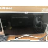 A SAMSUNG 31 INCH TELEVISION WITH REMOTE CONTROL IN WORKING ORDER