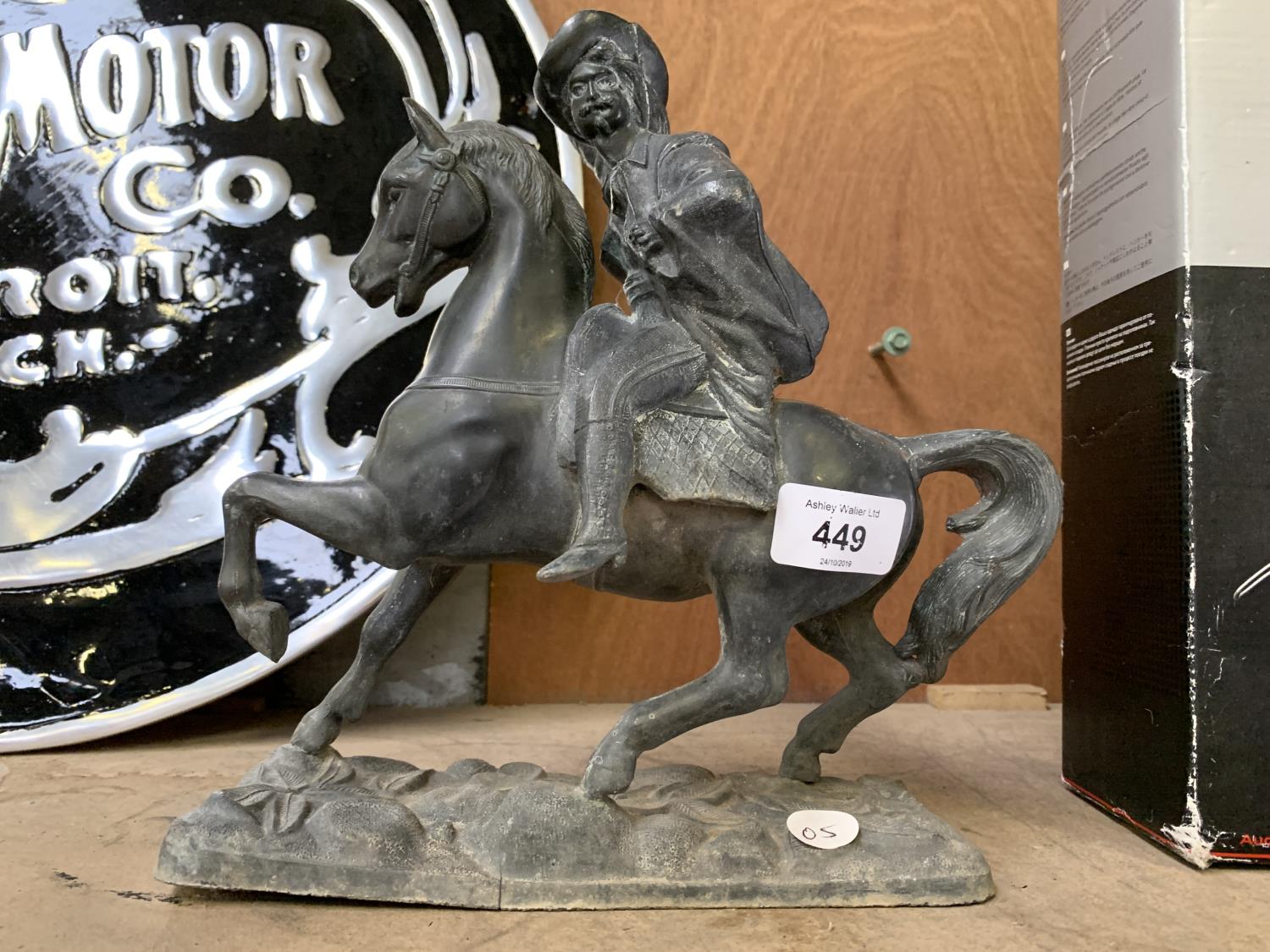 A VINTAGE METAL HORSE AND RIDER