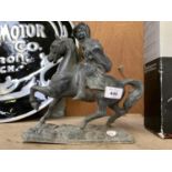 A VINTAGE METAL HORSE AND RIDER