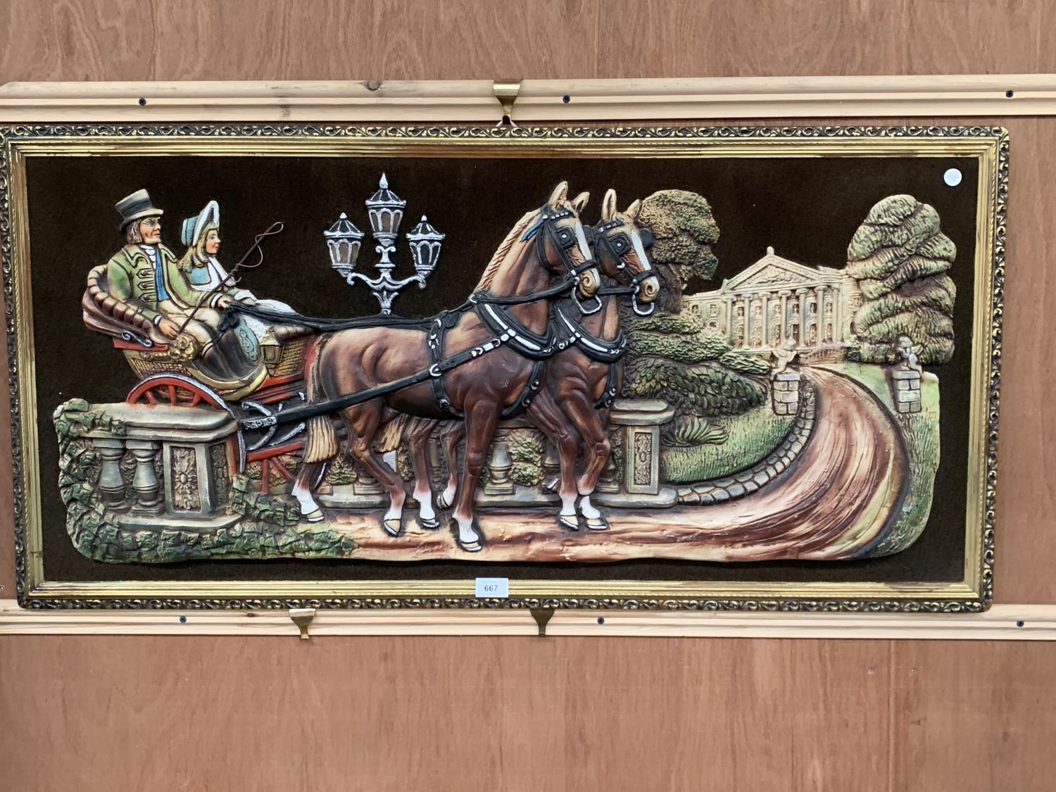 A LARGE FRAMED WALL HANGING OF A HORSE AND CART SCENE